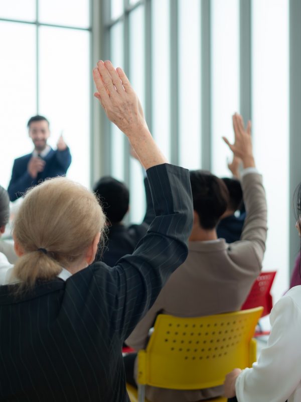 A group of business people organizes a seminar. Discuss the success of doing business